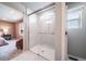 Glass shower with white marble-look tile, plus window for natural light and ventilation at 3879 N Shawnee St, Aurora, CO 80019