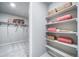 This walk-in closet includes ample shelving and clothes-hanging space at 3879 N Shawnee St, Aurora, CO 80019
