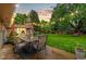 Charming backyard patio with a table and chairs set under string lights, creating a cozy outdoor dining space at 7442 S Wellington St, Centennial, CO 80122