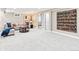 Bright basement living area featuring large painting and comfortable seating at 7442 S Wellington St, Centennial, CO 80122