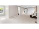 Spacious bedroom with neutral carpet, artwork, and cozy seating with natural light at 7442 S Wellington St, Centennial, CO 80122