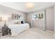 Small bedroom with a twin bed, grey walls, and a window with a view at 7442 S Wellington St, Centennial, CO 80122