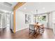 Bright dining area with hardwood floors, modern lighting, and views of the backyard at 7442 S Wellington St, Centennial, CO 80122