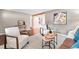 Comfortable living room featuring neutral decor, hardwood floors, and ample natural light at 7442 S Wellington St, Centennial, CO 80122