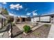 Backyard with garden beds, a shed, and a partially covered patio, creating a peaceful and functional outdoor space at 7541 Julian St, Westminster, CO 80030