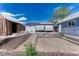 Spacious backyard with a shed, covered patio, and gravel area, perfect for outdoor activities and gatherings at 7541 Julian St, Westminster, CO 80030