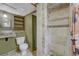 Bathroom with a rustic sink, toilet and standing shower at 7541 Julian St, Westminster, CO 80030