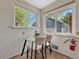 Sunny breakfast nook with a glass table and seating for two, perfect for enjoying your morning coffee at 7541 Julian St, Westminster, CO 80030