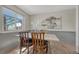 Charming dining room with wood-look floors, table and chairs at 7541 Julian St, Westminster, CO 80030