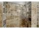 Close up of tiled shower with neutral color scheme and great fixtures at 7541 Julian St, Westminster, CO 80030