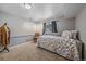 Bedroom featuring a floral daybed, a window with natural light, and a decorative coat rack at 6085 S Parfet St, Littleton, CO 80127