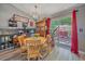 Cozy dining area with a view of the outdoor deck and a modern chandelier at 6085 S Parfet St, Littleton, CO 80127