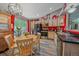 Bright dining area next to the kitchen and offers views to the backyard through large sliding glass doors at 6085 S Parfet St, Littleton, CO 80127
