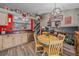 Inviting dining area adjacent to the kitchen with bar top and access to the backyard at 6085 S Parfet St, Littleton, CO 80127
