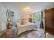 Bright bedroom with beautiful rugs, large windows, and ample natural light at 6085 S Parfet St, Littleton, CO 80127