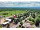 An aerial view shows the property near open green spaces and the Rocky Mountains on the horizon at 4856 E Hinsdale Pl, Centennial, CO 80122