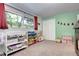 Charming bedroom with a large window, playful decorations, and ample storage at 4856 E Hinsdale Pl, Centennial, CO 80122