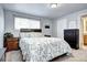 Comfortable bedroom with neutral walls, a queen-sized bed, and two dressers at 4856 E Hinsdale Pl, Centennial, CO 80122