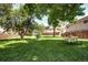 Lush green space with mature trees and a picnic table, perfect for outdoor gatherings and relaxation at 4856 E Hinsdale Pl, Centennial, CO 80122