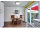 Inviting dining area featuring a wooden table set, hardwood floors, and sliding glass doors at 4856 E Hinsdale Pl, Centennial, CO 80122