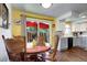 Cozy dining area featuring a wooden table set and sliding doors that lead to the backyard at 4856 E Hinsdale Pl, Centennial, CO 80122