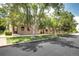 Charming row of townhomes featuring brick facade, well-manicured lawns, mature trees, and inviting curb appeal at 4856 E Hinsdale Pl, Centennial, CO 80122