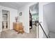 Bright upstairs hallway with a vanity nook and doorways to a bathroom and bedroom at 4856 E Hinsdale Pl, Centennial, CO 80122