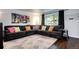 Comfortable living room with a cozy sectional, stylish decor, hardwood floors, and natural light at 4856 E Hinsdale Pl, Centennial, CO 80122