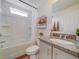 Bathroom featuring a shower-tub combination, granite countertops and white cabinetry at 13169 E 103Rd Pl, Commerce City, CO 80022