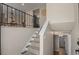 Inviting entryway featuring a staircase, hardwood floors, and modern decor, creating a stylish and welcoming ambiance at 9598 Lou Dr, Northglenn, CO 80260