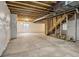 Large unfinished basement with exposed beams, with plumbing and electric at 6558 Kenzie Cir, Castle Pines, CO 80108