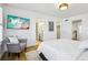 This bedroom features a TV and an adjacent bathroom and walk-in closet for convenience at 6558 Kenzie Cir, Castle Pines, CO 80108