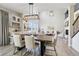 Well-appointed dining room with modern lighting, a spacious table, and an inviting atmosphere for gatherings at 6558 Kenzie Cir, Castle Pines, CO 80108