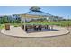 Shaded gazebo area with picnic tables, perfect for community gatherings and relaxation at 6558 Kenzie Cir, Castle Pines, CO 80108