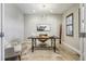 Home office featuring stylish decor, a modern light fixture, and a view of the outdoors at 6558 Kenzie Cir, Castle Pines, CO 80108