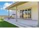 Covered patio with outdoor seating, perfect for entertaining at 6558 Kenzie Cir, Castle Pines, CO 80108