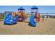 Vibrant playground with blue slides, climbing frames, and swings for active play at 6558 Kenzie Cir, Castle Pines, CO 80108