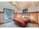 Serene bedroom featuring wood paneled walls, plush carpet and a window offering picturesque views at 5739 Highway 9, Breckenridge, CO 80424