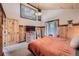 Bedroom showcasing unique lighting, wood accent walls, and scenic views through a large window at 5739 Highway 9, Breckenridge, CO 80424