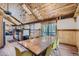 Inviting dining area featuring a large table, stylish lighting, and a seamless transition to the outdoor deck at 5739 Highway 9, Breckenridge, CO 80424