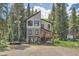Stunning mountain home with a unique design and inviting front porch perfect for relaxing and enjoying nature at 5739 Highway 9, Breckenridge, CO 80424