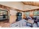 Comfortable living room with wood accents, large windows providing natural light, and inviting decor at 5739 Highway 9, Breckenridge, CO 80424