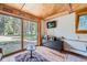 Living room features wood ceiling, modern furniture, and sliding glass doors with scenic outdoor views at 5739 Highway 9, Breckenridge, CO 80424