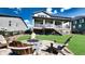 Backyard with a stone firepit and Adirondack chairs, creating a cozy outdoor living space at 8867 S Zante St, Aurora, CO 80016