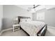 Bright bedroom with large windows and stylish dark-stained wood furniture at 8867 S Zante St, Aurora, CO 80016