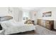 Comfortable bedroom featuring soft carpet, natural light, and a cozy teddy bear at 8867 S Zante St, Aurora, CO 80016