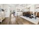 An elegant dining room boasts hardwood floors, tray ceiling, and open access to the staircase and other living spaces at 8867 S Zante St, Aurora, CO 80016