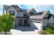 Charming home featuring solar panels, a two-car garage, and a welcoming front porch perfect for relaxing or entertaining guests at 8867 S Zante St, Aurora, CO 80016