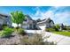 Beautiful two-story home featuring a three-car garage, well-maintained landscaping, and solar panels on the roof at 8867 S Zante St, Aurora, CO 80016