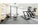 Home gym featuring free weights, weight machines, mirrors and rubber flooring at 8867 S Zante St, Aurora, CO 80016
